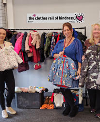 Clothes Rail Of Kindness With Sign