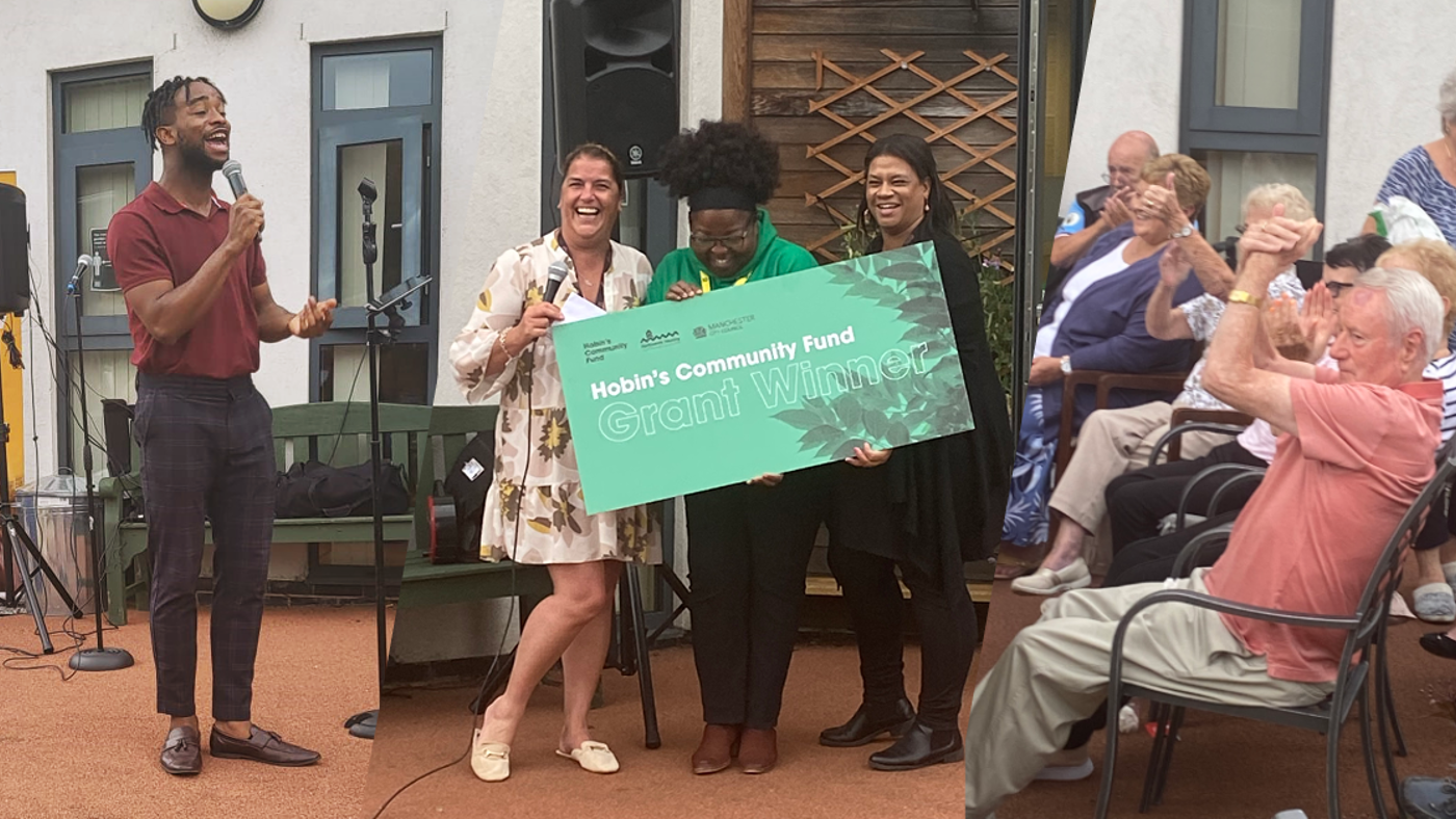 three hobin's winners holding a large cheque with people clapping