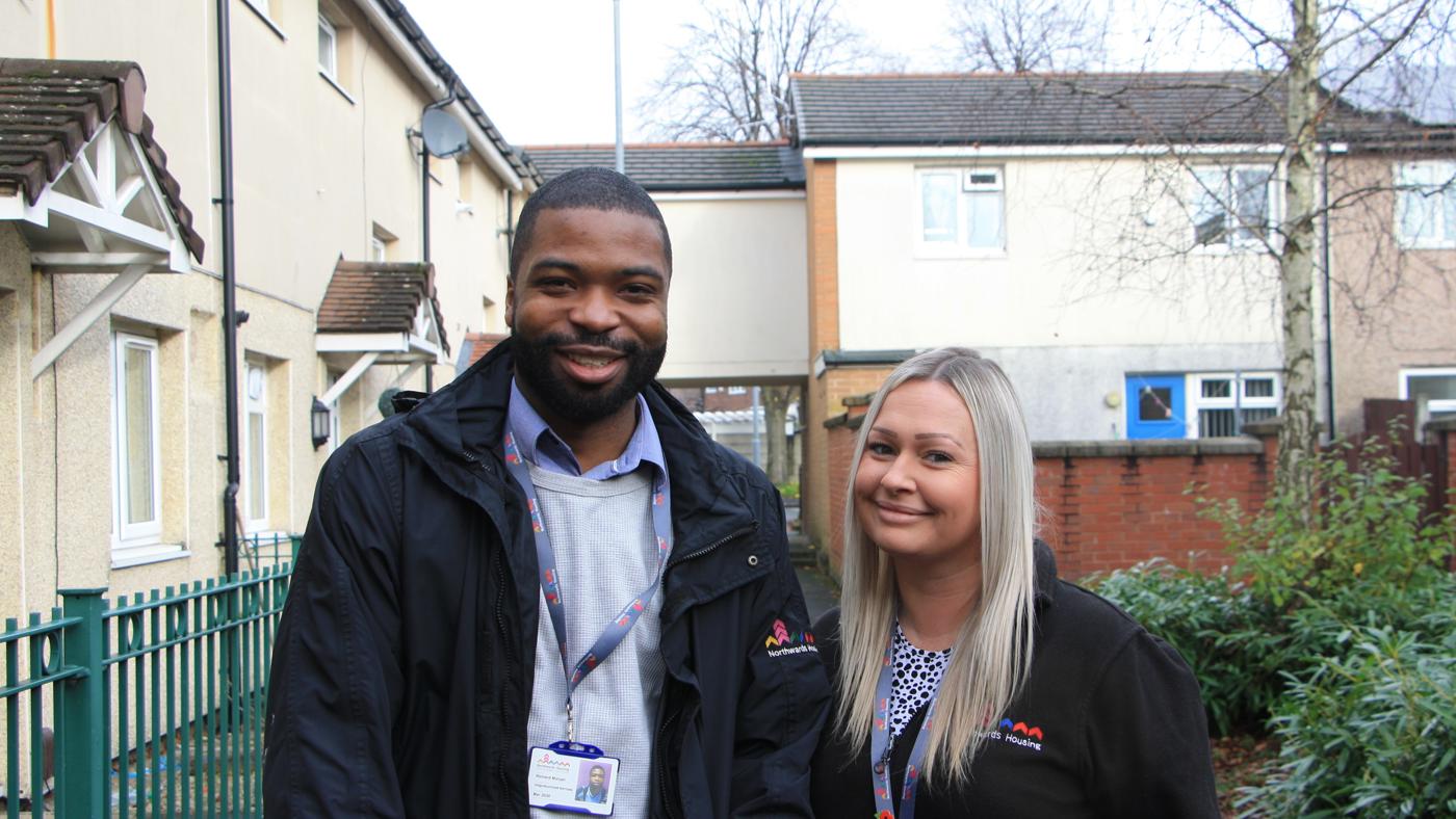 two neighbourhood Housing Officers On An Estate Walkabout