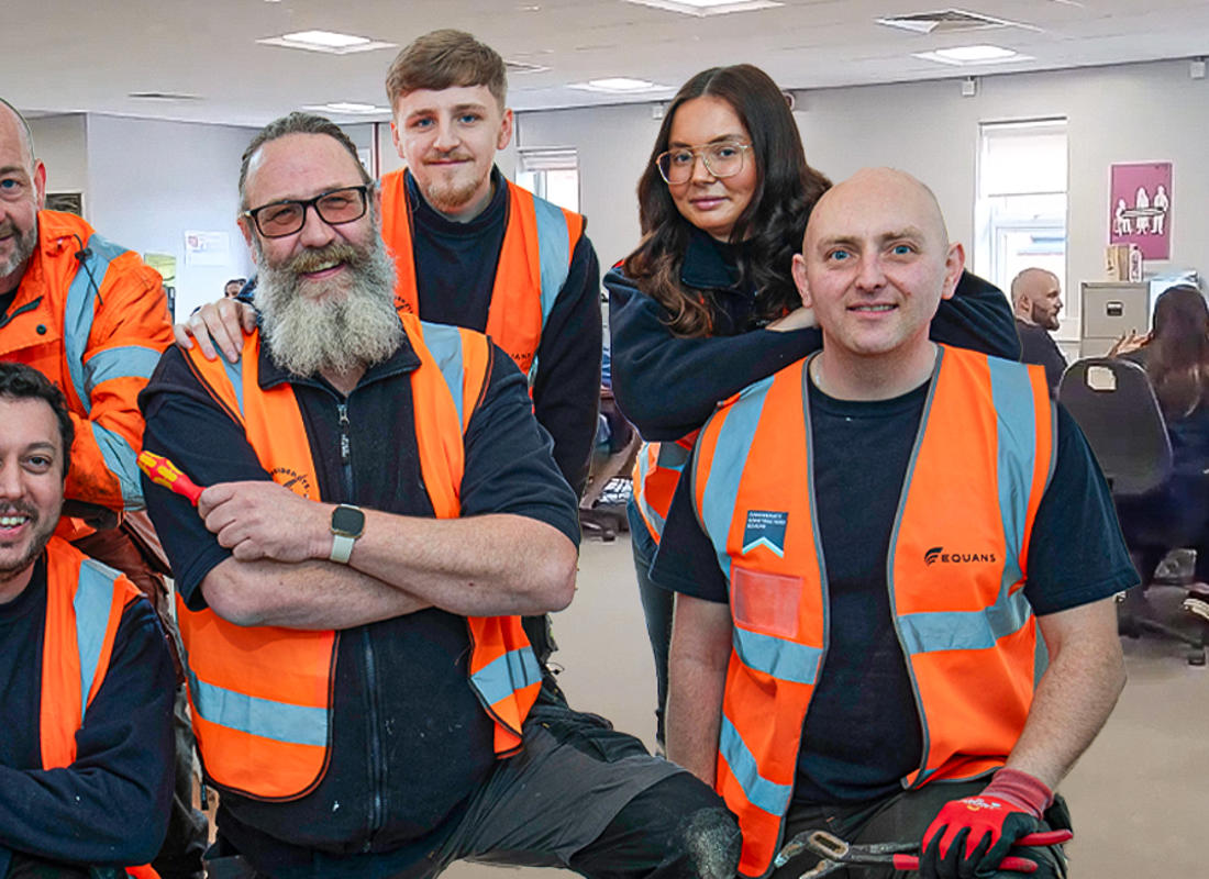 repairs team posing for a photo with the call centre in the background
