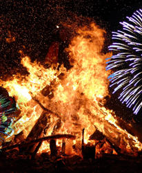 bonfire flocked with exploding fireworks