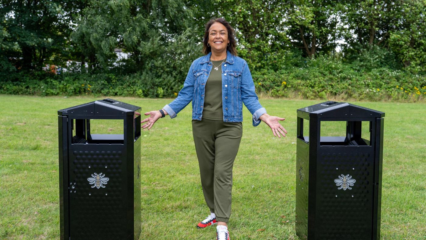 clean and green woman between two brand new mcr bins