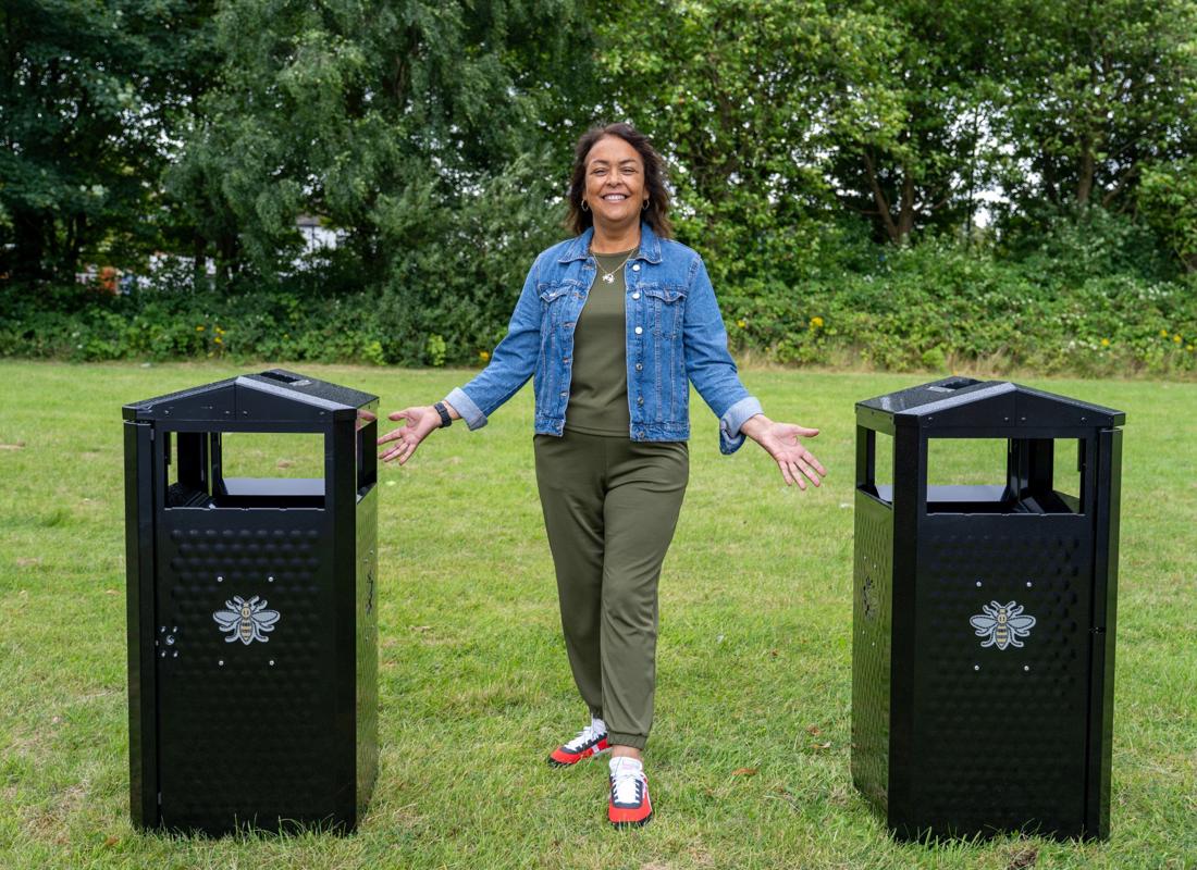 clean and green woman between two brand new mcr bins