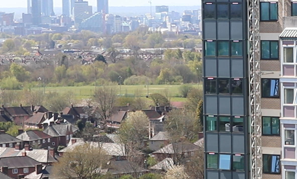 a drone picture of north Manchester, with the city centre in the distance