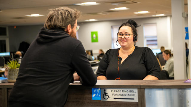 Nicola on reception at White Moss Road talking to a tenant