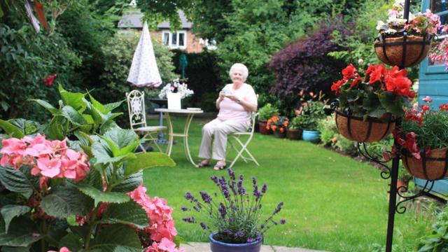 Norma Ogden Having A Drink In Her Garden On Warbeck Road