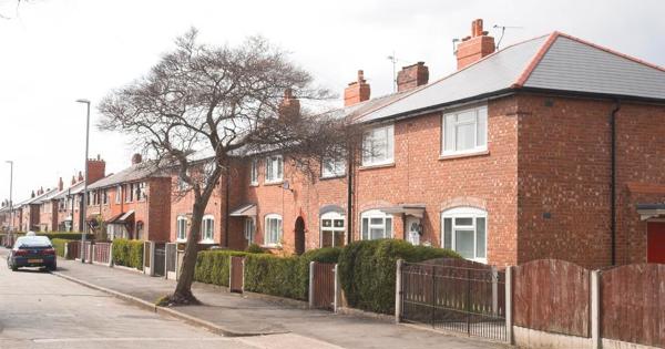 a row of semidetached houses on a street in north manchester