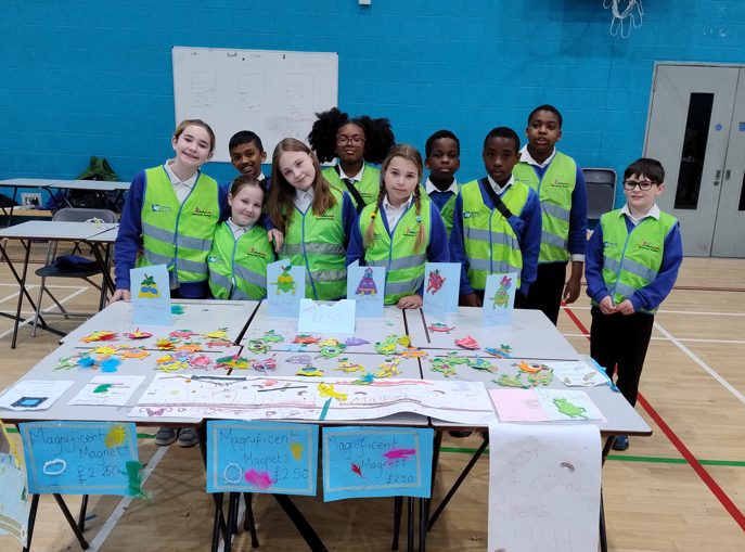 urban crew members standing in front of a table of all of their hard work