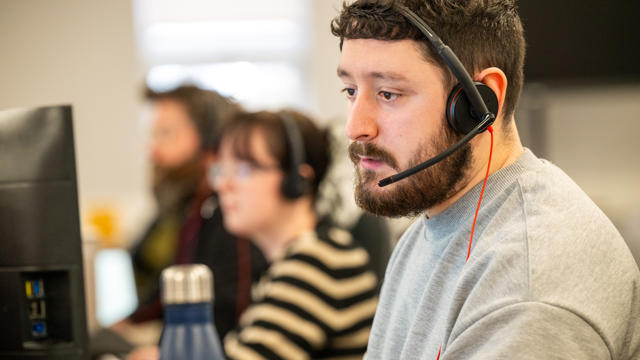 A group of CSC operatives on the phone to residents