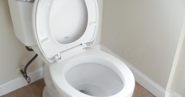 a white toilet with the lid up